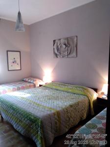 Posteľ alebo postele v izbe v ubytovaní Appartamenti Vista Gransasso