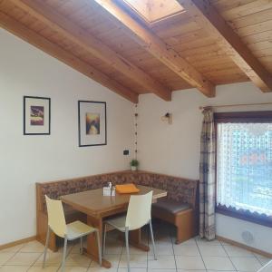 a dining room with a table and chairs at GARDAINN La CASCINA in Riva del Garda