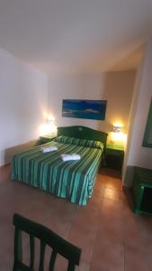 A bed or beds in a room at Le Vanille