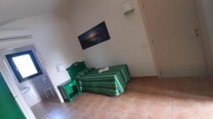 A television and/or entertainment centre at Le Vanille