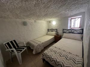 Posteľ alebo postele v izbe v ubytovaní LA CUEVA de TONI EL SECO