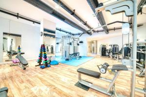 a gym with exercise equipment and a christmas tree at Aphrodite Beachfront Apartment - North Cyprus in Ghaziveran