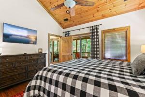 a bedroom with a black and white checkered bed at Welcome to Padre's Mountain Paradise! in Blowing Rock
