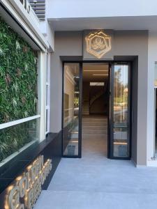 a entrance to a building with a glass door at Golden Island Resorts in Athens