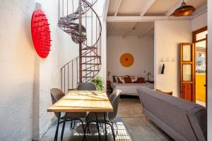 a dining room with a table and chairs and a bedroom at Amazing loft w/ terrace in Mexico City Downtown in Mexico City