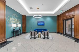 a lobby of a hotel with a blue wall at Journal Commons 325 Luxurious Cozy 1BR near Historic Third Ward in Milwaukee