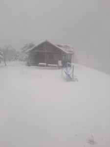 a building with a playground in the snow at בקתות קסם חרמון in Nimrod