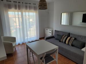 a living room with a couch and a table at Ruidera Entre Balcones in Ruidera