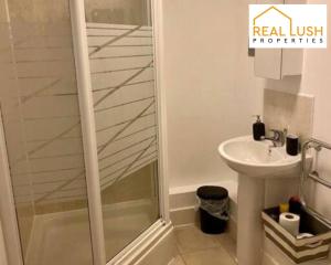 a bathroom with a shower and a sink at Real Lush Properties - East Street - Luxury Two-Bedroom Apartment In Leicester in Leicester