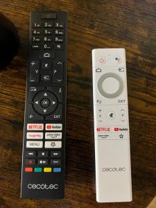 two remote controls sitting next to each other on a table at Mirador Virgen de Gracia in Toledo