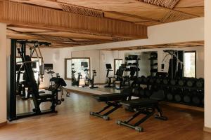 a gym with a lot of treadmills and machines at Maroma, A Belmond Hotel, Riviera Maya in Puerto Morelos