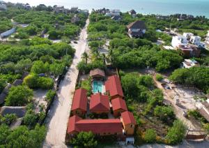 an overhead view of a house with a red roof at Anicca Aldea in Holbox Island