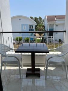 a table and two chairs sitting on a patio at Villa Hania Boutique Hotel - Adults only in Side