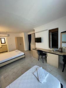 a hotel room with a bed and a desk at Villa Hania Boutique Hotel - Adults only in Side