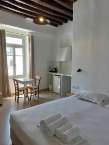 Postel nebo postele na pokoji v ubytování Castellino Naxos