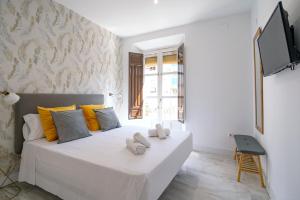 Granadi Apartamentos客房内的一张或多张床位