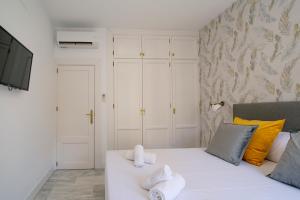 Granadi Apartamentos客房内的一张或多张床位