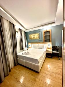 a bedroom with a large white bed in a room at Newalla Hotel Old City in Istanbul