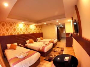 Rúm í herbergi á Hotel Simal