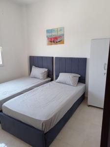 Llit o llits en una habitació de 2 bedrooms private townhouse in Zayed