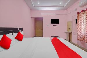 Кровать или кровати в номере OYO Flagship Anu prime suites