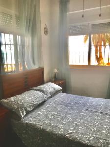 Кровать или кровати в номере Apartamento Mar Menor, Los Urrutias - Beachfront apartment with patio