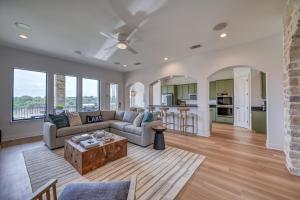 a living room with a couch and a table at Luxury Lakefront Home-Private Dock - Dipping Pool! in Spicewood
