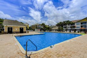 a large swimming pool in front of a building at Havens 1123 in North Myrtle Beach