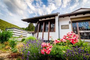 a flower garden in front of a building at WINETIME in Oberhausen