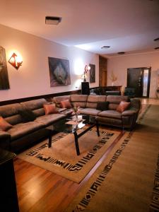 a living room with a couch and a table at Villa Amsterdam in Ohrid
