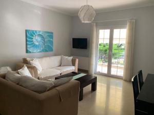 a living room with a couch and a coffee table at Seas the Day in Preveza
