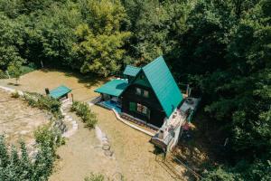 an aerial view of a house with a green roof at Koliba TAMAN in Konjic