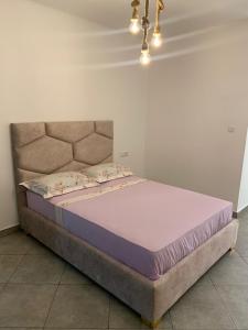 a bed in a bedroom with a large mattress at MTL residence in Oujda