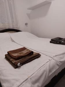 A bed or beds in a room at Erzsebet Apartman, free parking