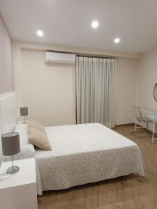 Posteľ alebo postele v izbe v ubytovaní Hostal Infantes