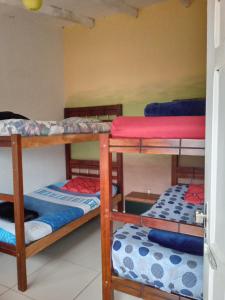 a group of bunk beds in a room at Casa Sayana in Samaipata