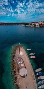 a group of boats sitting in the water at Penny's Beach Cottage in Galaxidi