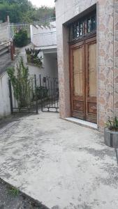 a building with a large wooden door in front of it at La Llave 