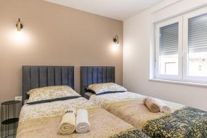 Postel nebo postele na pokoji v ubytování Apartman Suzi