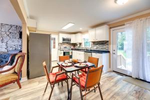 a kitchen and dining room with a table and chairs at Cozy North Carolina Retreat Near Beaches and Golfing in Jacksonville
