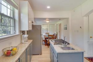 a kitchen with a sink and a counter top at Renovated Louisiana Rental Near Mississippi River 