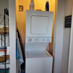 a white washer and dryer in a closet at Relaxing Stay Near the Beach in Hampton