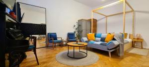 a living room with a couch and two chairs at Zeiss house in Braşov