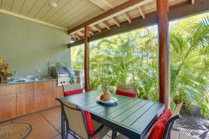 an outdoor dining room with a table and chairs at Luxe Big Island Vacation Rental Along Kohala Coast in Waikoloa