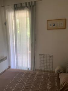 Posteľ alebo postele v izbe v ubytovaní Votre séjour cosy à Frejus!