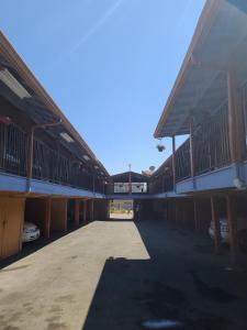 an empty parking lot in a large building at Nights Inn Motel in Oakland