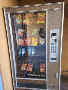 a vending machine full of chips and other snacks at Nights Inn Motel in Oakland
