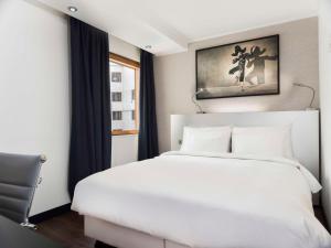 Postel nebo postele na pokoji v ubytování Radisson Blu Royal Viking Hotel, Stockholm