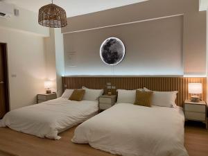 Postel nebo postele na pokoji v ubytování 月月寓室 Luna INN 民宿