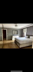 Ein Bett oder Betten in einem Zimmer der Unterkunft Nadide sokak daire4 dublex